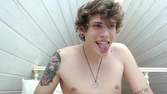Attractive twink with curly hair bursts up