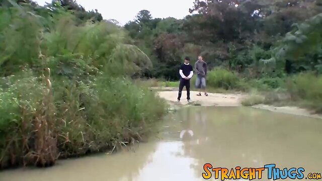 Two straight guys are jacking outdoors and competing