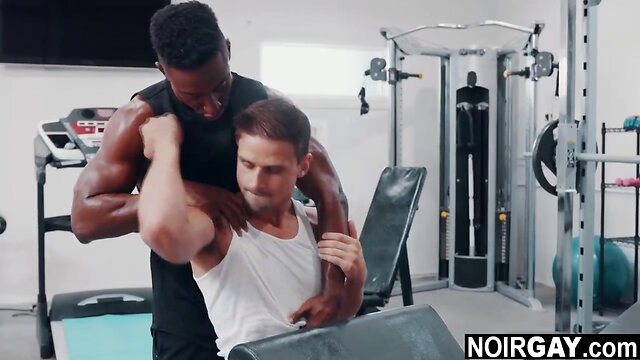 Interracial gay sex in the gym