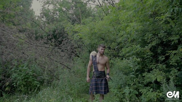 Lovely shirtless guy in scottish kilt playing with dick