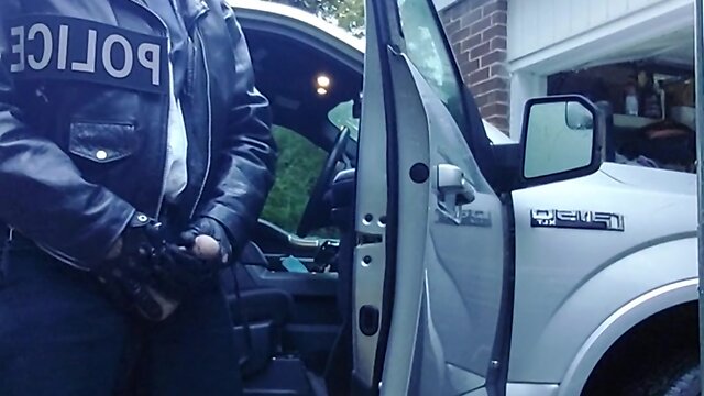 Officer enjoys cigar at end of shift