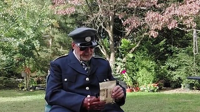 Military officer enjoys smoking his pipe and relaxing