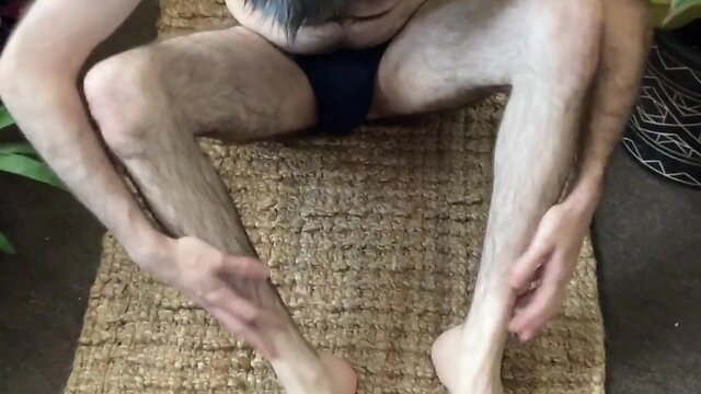Amateur bear man strips naked, stretches and lazes