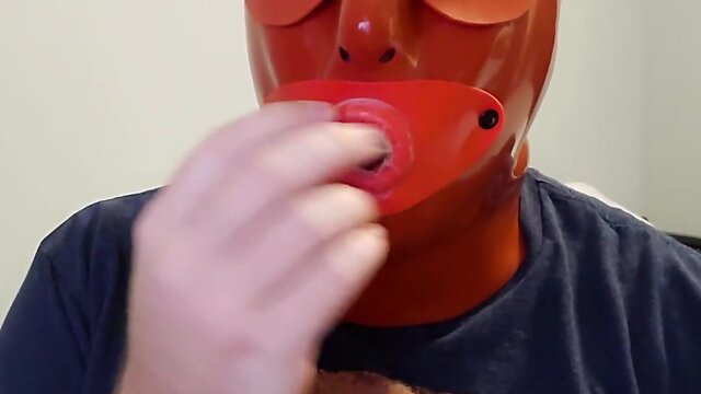 Latex sissy swallows 5 cum loads in hooded slave